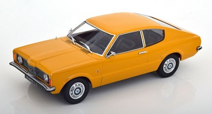 1:18 scale yellow vintage diecast car model with chrome details on white background