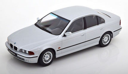 1:18 scale silver BMW diecast model car sedan on white background