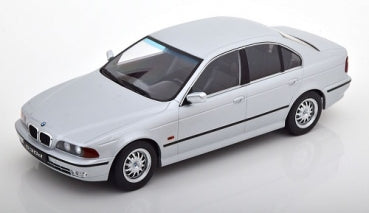 1:18 scale white BMW sedan diecast model car with black trim on white background