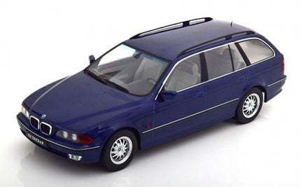 1:18 scale diecast model of blue BMW touring car, detailed exterior, white background