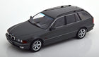 1:18 scale diecast model of a black BMW estate car with chrome trim on white background