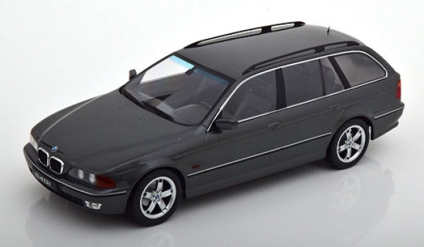 1:18 scale diecast model of a black BMW estate car with chrome trim on white background