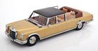 1:18 scale diecast model of a classic gold luxury convertible car with black roof and tan interior