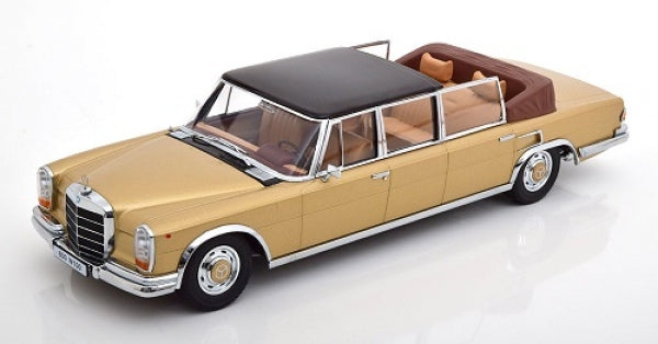 1:18 scale diecast model of a classic gold luxury convertible car with black roof and tan interior