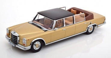 Gold and black 1:18 scale diecast classic model car with tan interior and open roof