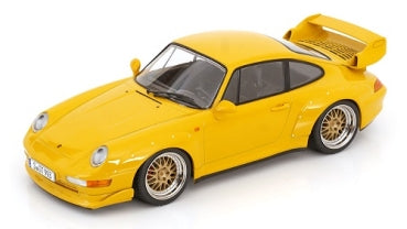 Yellow 1:18 scale diecast Porsche model car with rear spoiler and gold wheels