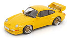 Yellow 1:18 scale diecast Porsche model car with rear spoiler and detailed wheels
