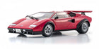 Red 1:18 scale diecast Lamborghini Countach model car with rear spoiler on white background