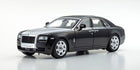 Black luxury sedan diecast model car in 1:18 scale on white background