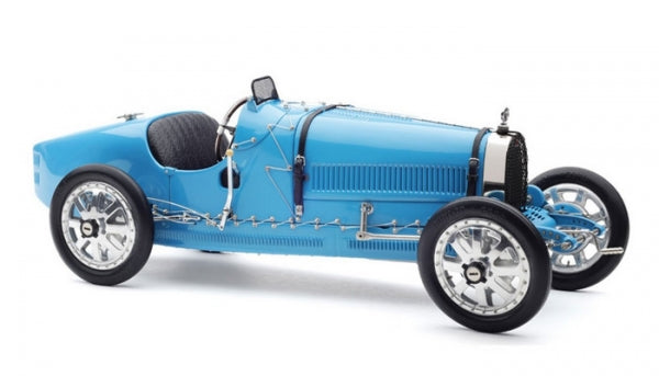 Blue 1:18 scale vintage diecast model car with chrome wheels and detailed interior