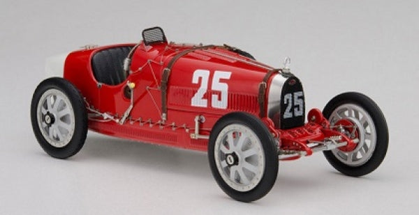 Red vintage race car diecast model with number 25, white wheels, and black seat