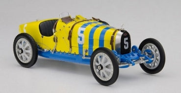 1:18 scale diecast model of vintage yellow and blue race car with number 5 on grille