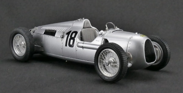 1:18 scale diecast vintage silver race car model with number 18, detailed wheels and cockpit