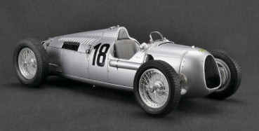1:18 scale silver vintage race car diecast model with number 18, detailed wheels, and open cockpit