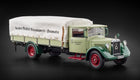 1:18 scale diecast vintage Mercedes-Benz truck model with covered cargo, green and cream color