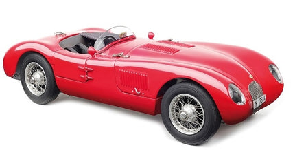 Red vintage diecast model car in 1:18 scale with wire wheels and detailed open cockpit