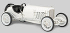 White vintage diecast model race car with black seats, detailed engine, and spoked wheels