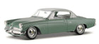 Green diecast classic model car 1:18 scale with silver roof and detailed wheels