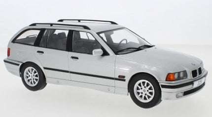 1:18 scale silver BMW touring diecast model car with detailed wheels and roof rails