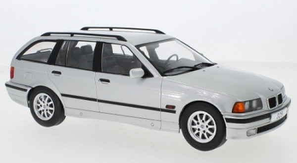 1:18 scale silver BMW touring diecast model car with detailed wheels and roof rails