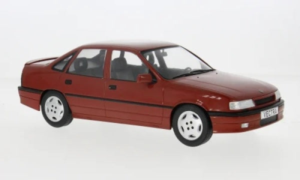 Red diecast model car, four-door sedan, 1:18 scale, white wheels, on white background