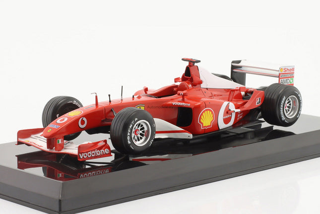 https://automodele.eu/environment/cache/images/productGfx_759688_0_0/MW2ALA0009-Ferrari-F2002-1-Michael-Schumacher-Formula-1-F1-World-Champion-2002-Premium-Collectibles-124.jpg