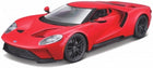 Red diecast model sports car with black wheels, detailed headlights, and aerodynamic design