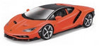 Orange diecast model sports car with black roof, detailed wheels, and sleek aerodynamic design.