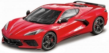 Red diecast Corvette sports car model with black wheels and detailed exterior on white background