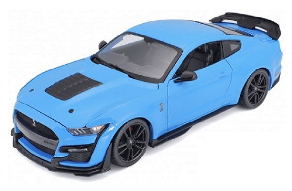 Blue diecast model car in 1:18 scale, detailed sports coupe with black accents and rear wing