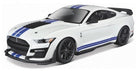 White diecast model car with blue racing stripes, black wheels, and rear spoiler, 1:18 scale