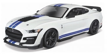 White diecast model car with blue racing stripes, black wheels, and rear spoiler, 1:18 scale.