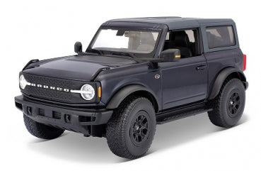 Black diecast model SUV in 1:24 scale with detailed wheels and realistic features