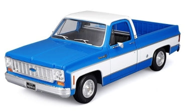 1:24 scale blue and white pickup truck diecast model with detailed front grille and wheels