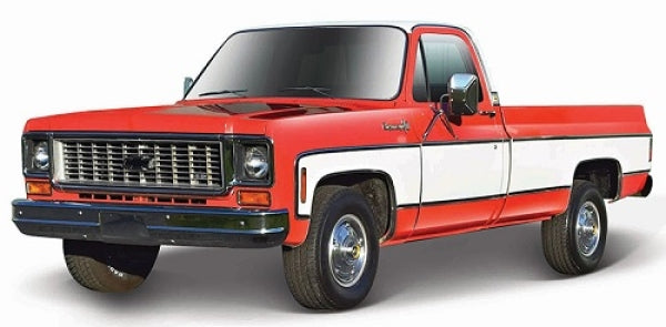 Red and white diecast model vintage pickup truck in 1:24 scale, classic design