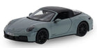 1:18 scale diecast model car, light blue coupe with black roof and detailed wheels