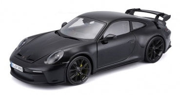 Black diecast model Porsche sports car with rear spoiler, 1:18 scale, side view