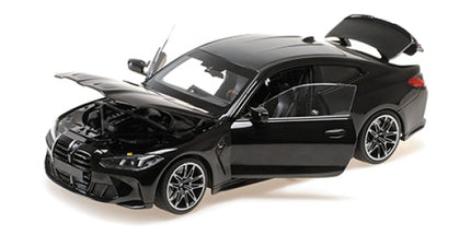 1:18 scale black diecast model car with open doors, hood, and trunk, detailed interior