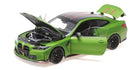 Green diecast model car with open doors, hood, and trunk, 1:18 scale collectible