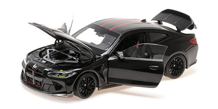 1:18 scale black BMW diecast model car with open doors, hood, and trunk on white background