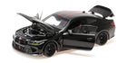 1:18 scale black BMW diecast model car with open doors, hood, and trunk on white background
