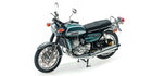 Detailed diecast model motorcycle in blue with chrome accents on white background