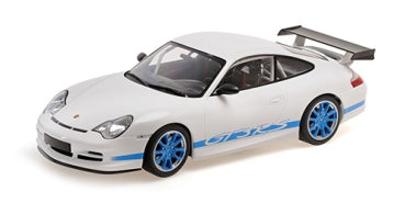 1:18 scale white Porsche model car with blue wheels and side stripes, large rear spoiler