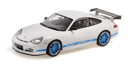 1:18 scale white Porsche model car with blue wheels, blue GT3 RS decals, and large rear wing