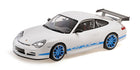 1:18 scale white Porsche model car with blue wheels, blue GT3 RS decals, and large rear wing