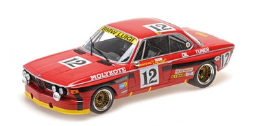 Red 1:18 scale diecast BMW race car model with racing decals and gold wheels