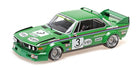 Green 1:18 scale diecast classic racing car model with racing decals and rear spoiler
