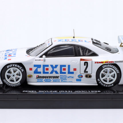 https://a.allegroimg.com/original/117062/9d8a21304174b2bcab06c986fa0a/Nissan-Skyline-GT-R-R33-2-JGTC-Zexel-LDF-1998-Kageyama-Suzuki-Ebbro-1-43-Kod-producenta-44253