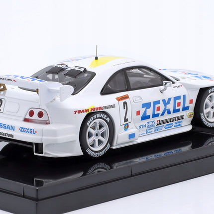 https://a.allegroimg.com/original/11522f/a28c8cdb4e28b214fea4c7522773/Nissan-Skyline-GT-R-R33-Zexel-2-JGTC-1998-Kageyama-Suzuki-Ebbro-1-43-Stan-opakowania-oryginalne