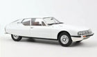 White diecast model car with vintage coupe design on plain background